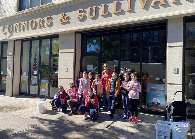 Fifth Graders from Local Public School 70 decorate the window of Connors & Sullivan’s Bay Ridge Office as part of the annual Autumn Fall Window Painting Contest sponsored by the Bay Ridge Community Council