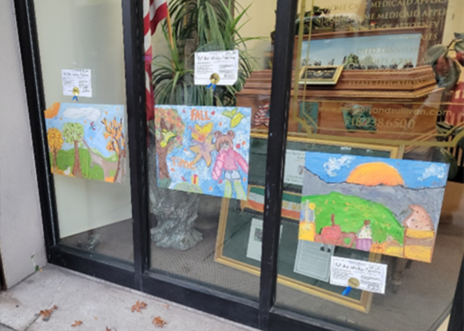 Fifth Graders from Local Public School 70 decorate the window of Connors & Sullivan’s Bay Ridge Office as part of the annual Autumn Fall Window Painting Contest sponsored by the Bay Ridge Community Council